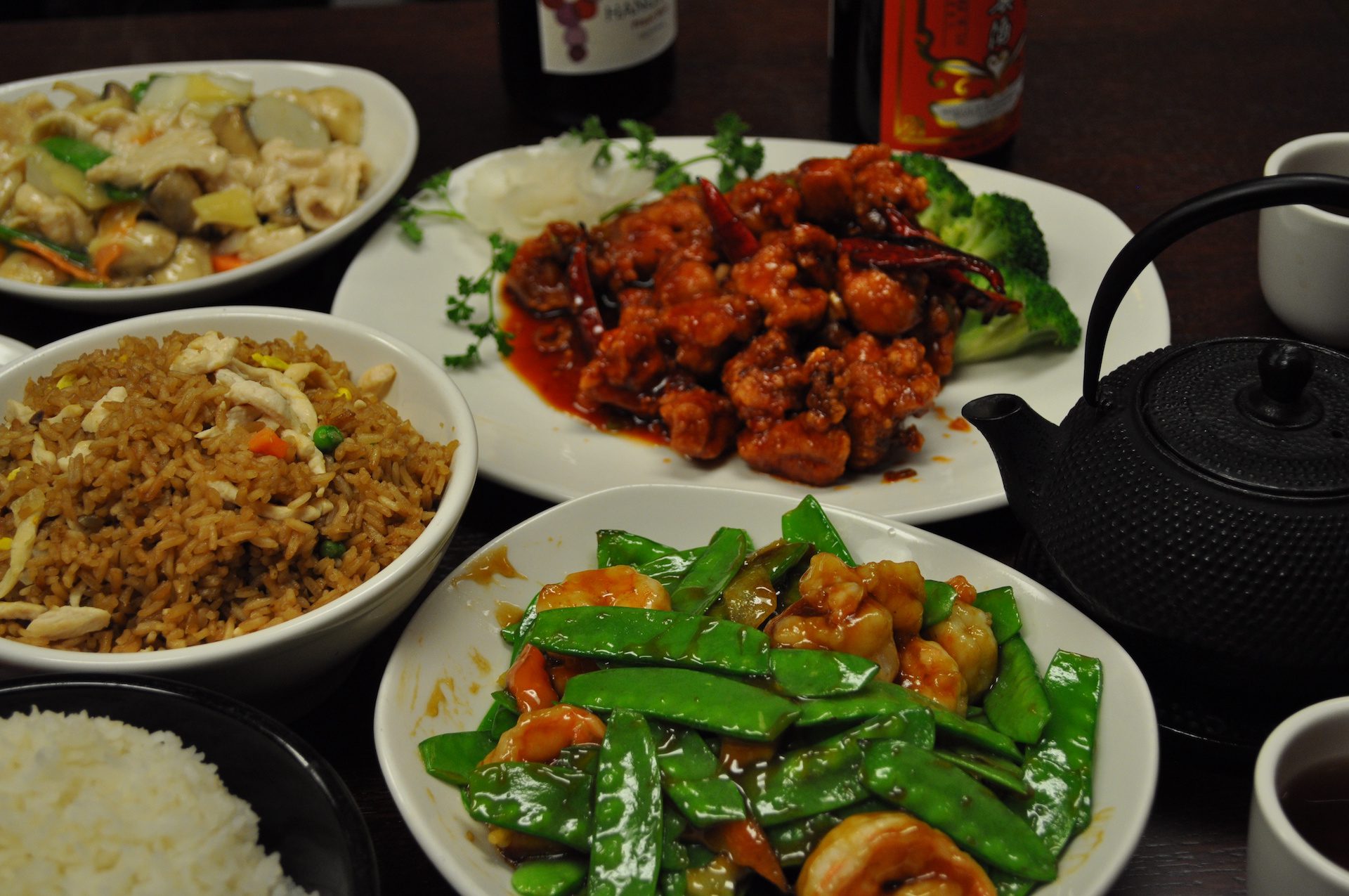 Spread of dishes at Chen Chinese Cuisine: General Tso's Chicken, shrimp with snow peas, and fried rice